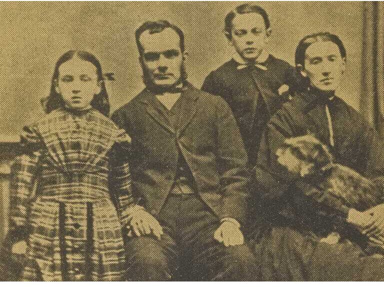 Photograph of Greyfriars Bobby. The late Mr Traill and family, with Greyfriars Bobby in Mrs Traill's lap