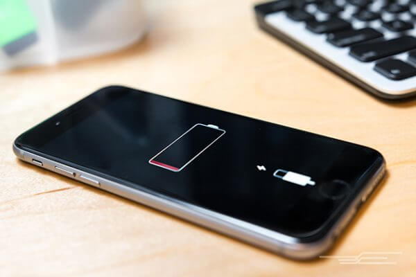 an iphone with the battery low indicator on the screen