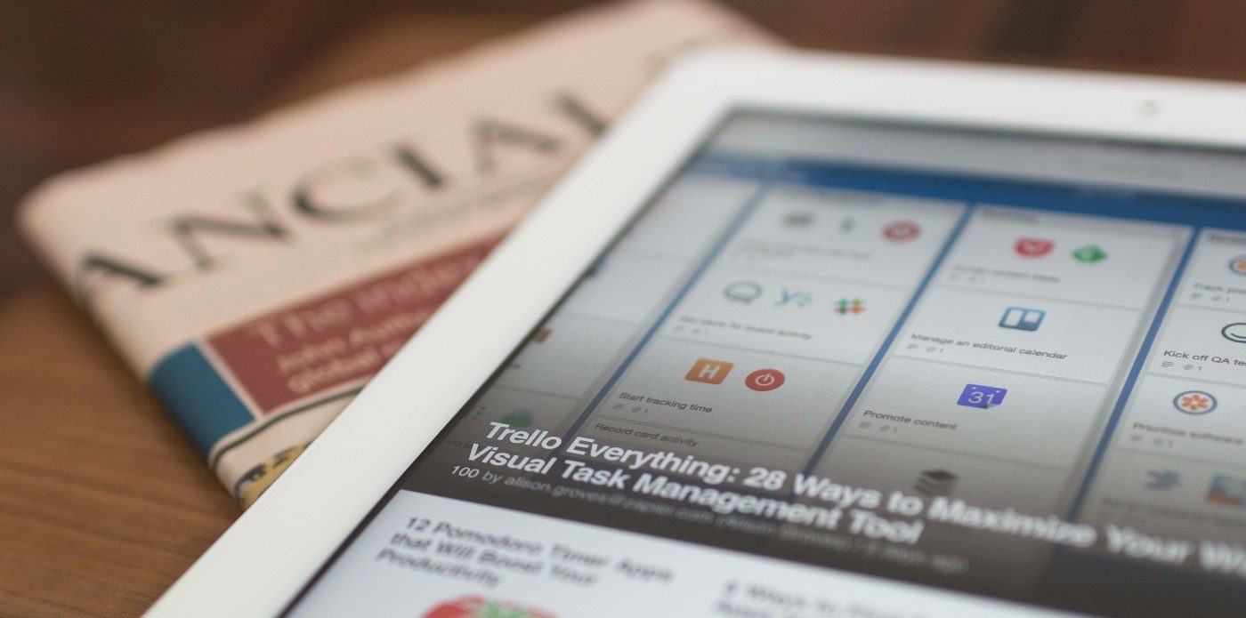 An iPad lying on top of the Financial Times newspaper