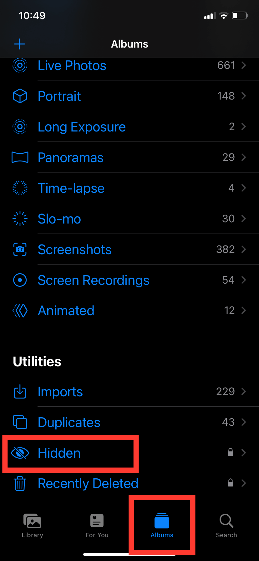 The iOS 16 Photos Albums menu. At the bottom, underneath the Utilities sub-menu, we have highlighted the Hidden folder option with a red box